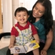 A mother reads with her toddler